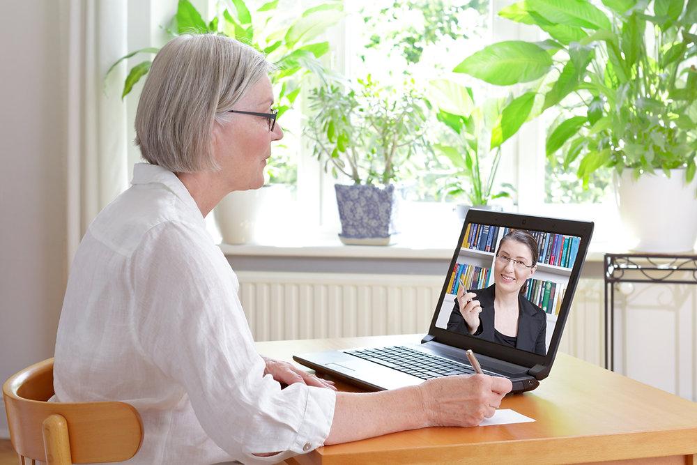 woman completely a Telehealth appointment for speech language therapy online